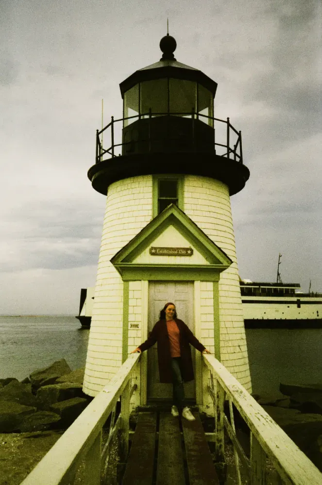 A film photograph of Charlee Remitz at the Brand Point lighthouse in Massachusets
