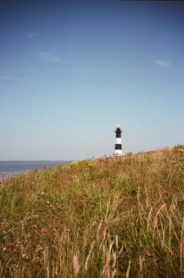A film photograph of Vuurtor Breskens lighthouse on a sunny day