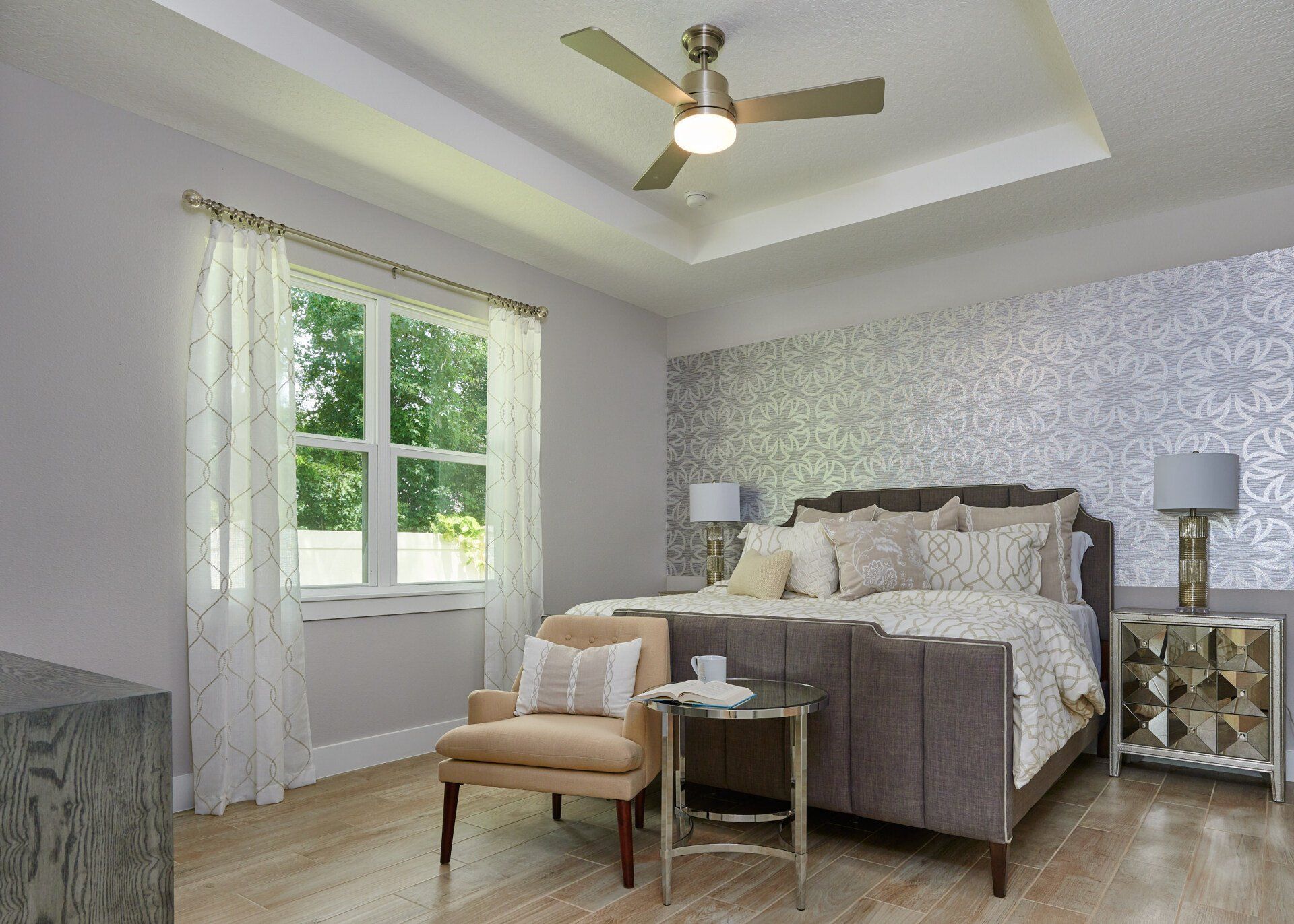 Arisha Enclave open dining and living room with natural light and ceiling fan