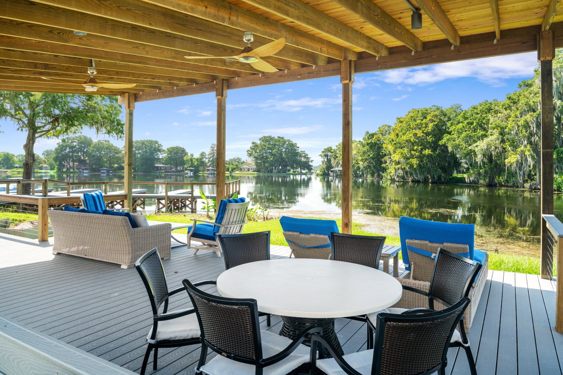 Lake Killarney Townhomes patio overlooking the lake with pergola seating and waterfront views.