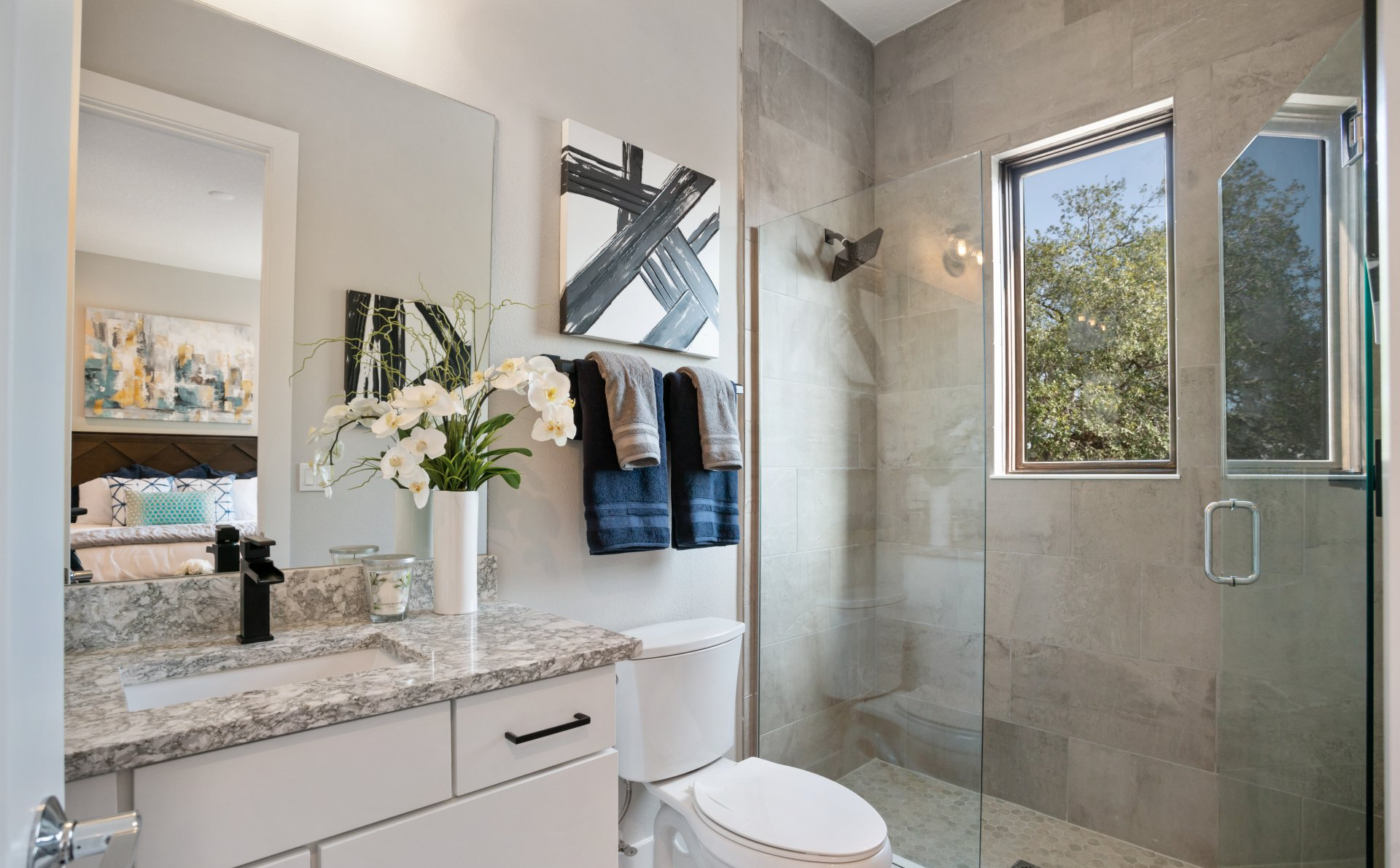 Lake Killarney Townhomes hallway leading to bathroom with modern tile and glass shower