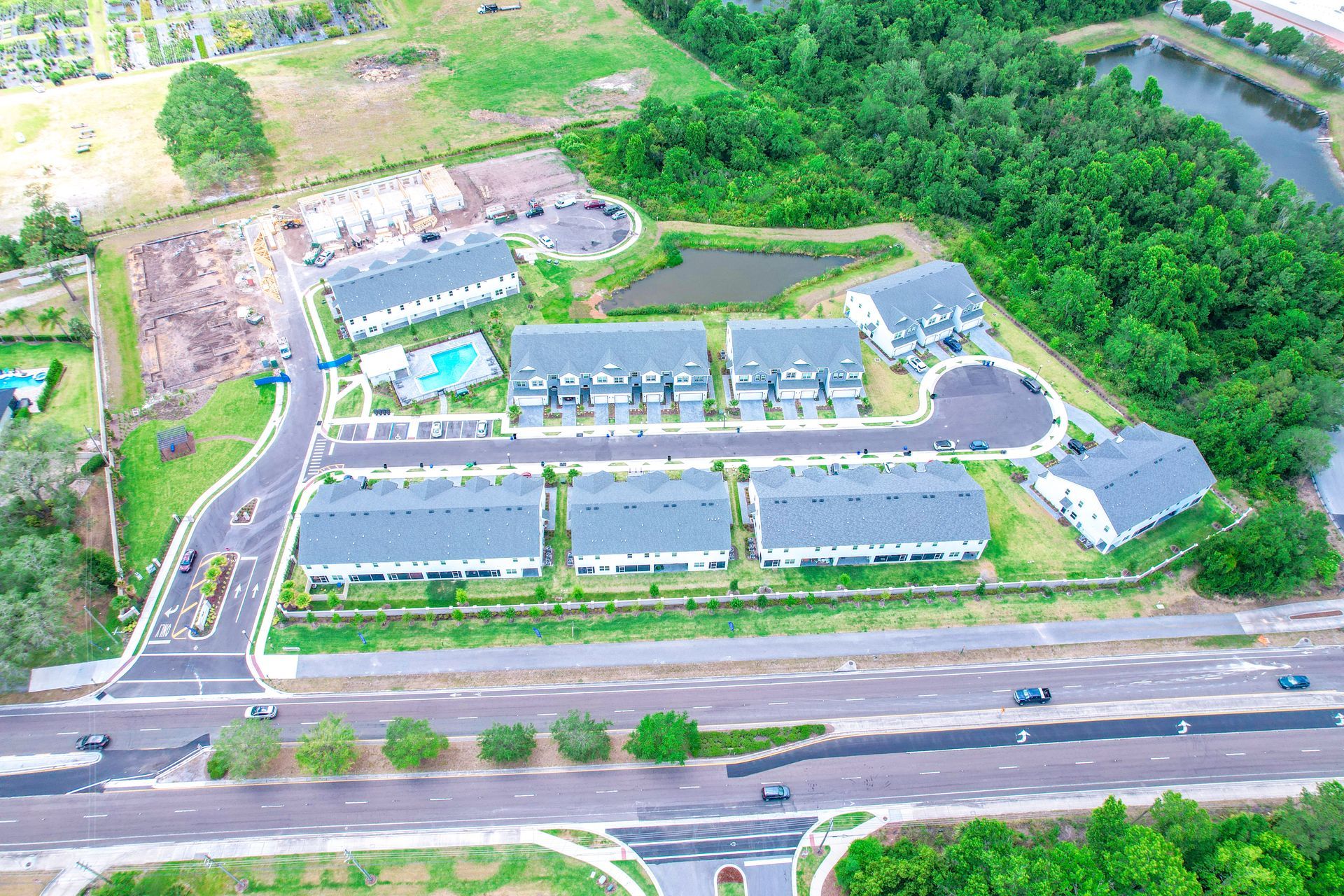 Aerial photo of Brentwood Landing showing full community layout, buildings, green space, and parking areas.
