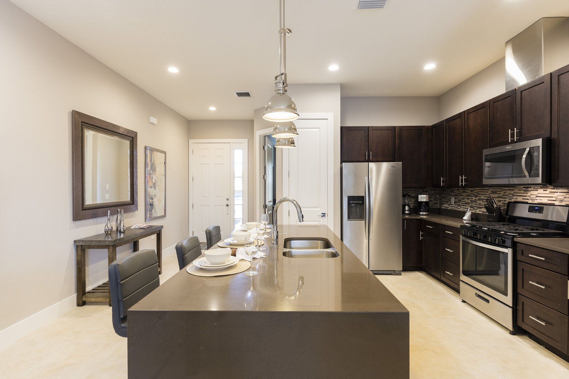Open living and dining area at Summerville Resort with modern finishes and recessed lighting.