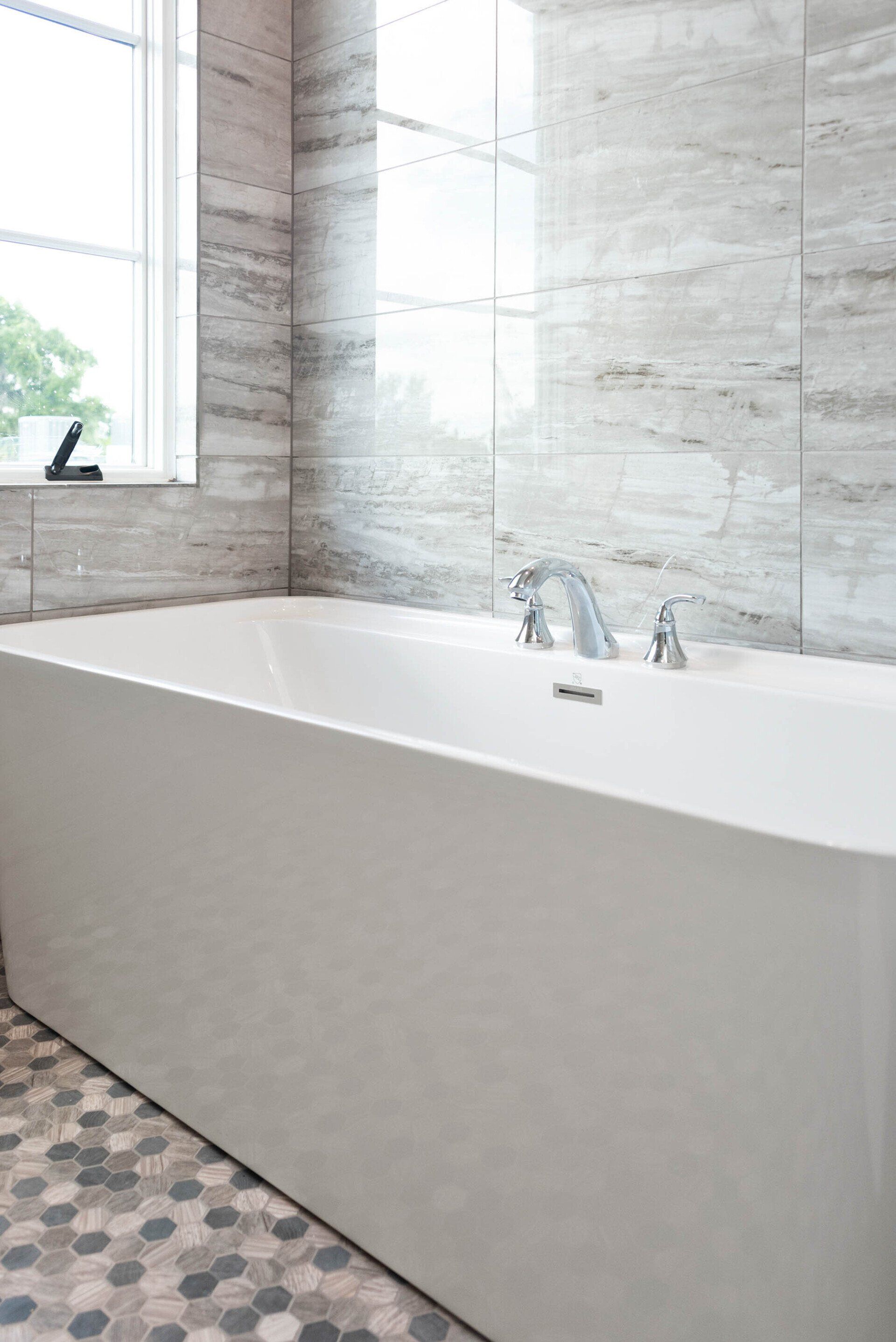 Luxury bathroom featuring a tiled walk-in shower and glass enclosure