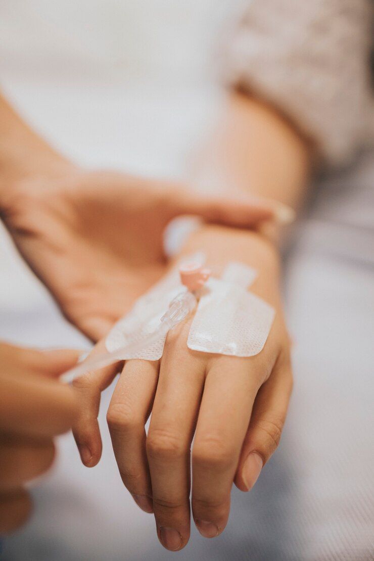 A close up of a person 's hand with a bandage on it.