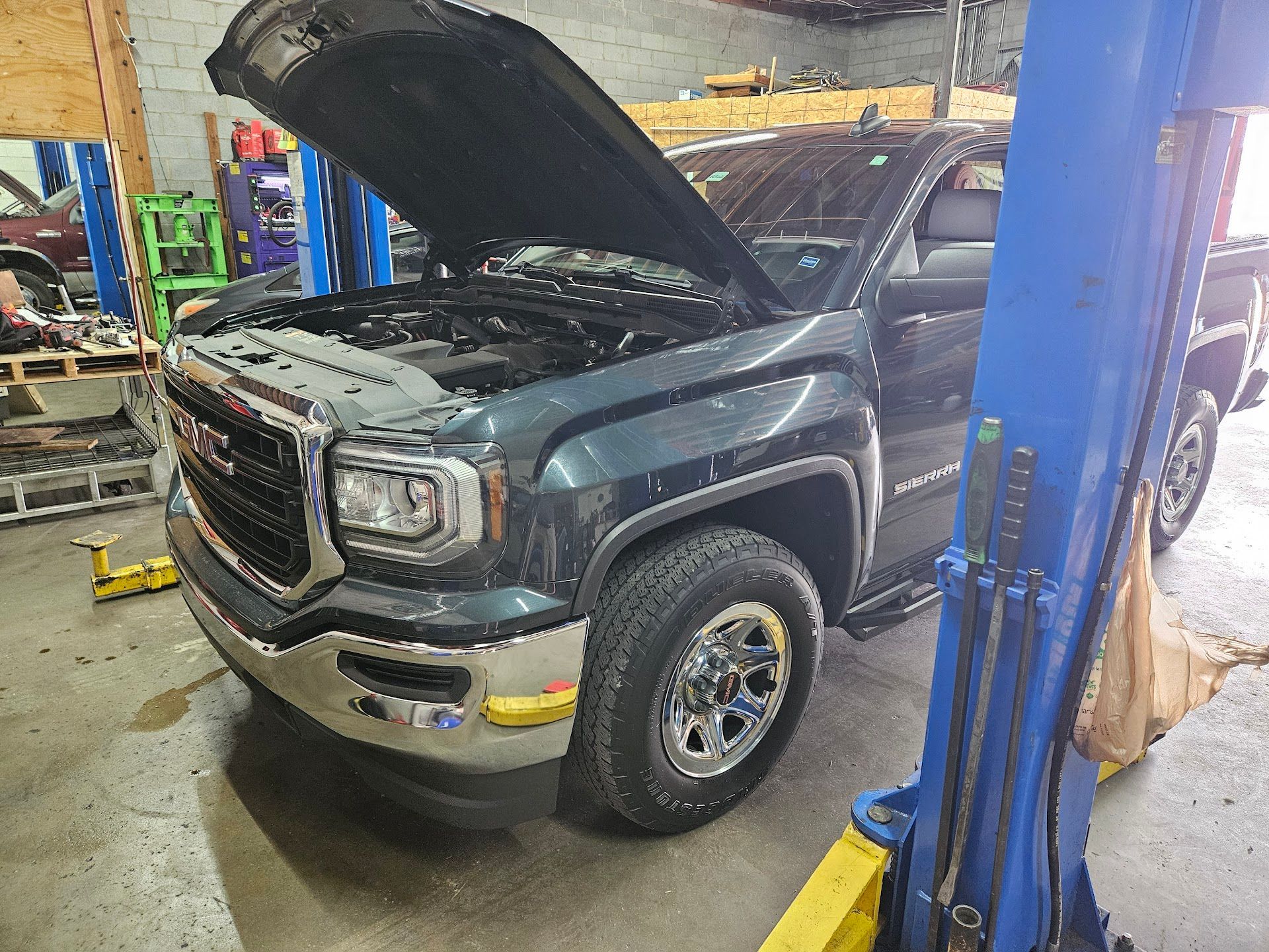 GMC Truck Service On Shop Lift | HWY 42 Auto Service