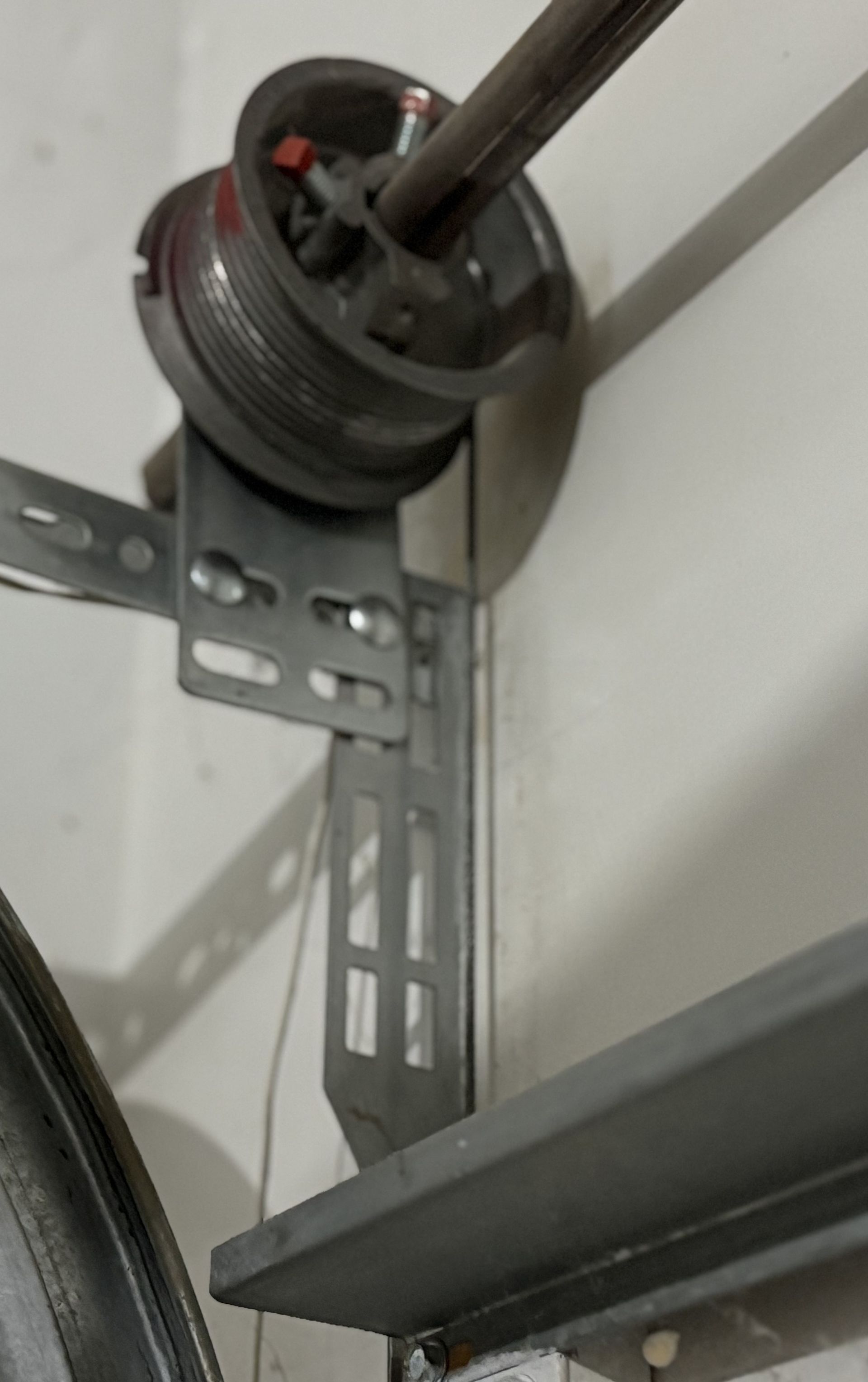 A close up of a garage door opener in a garage.