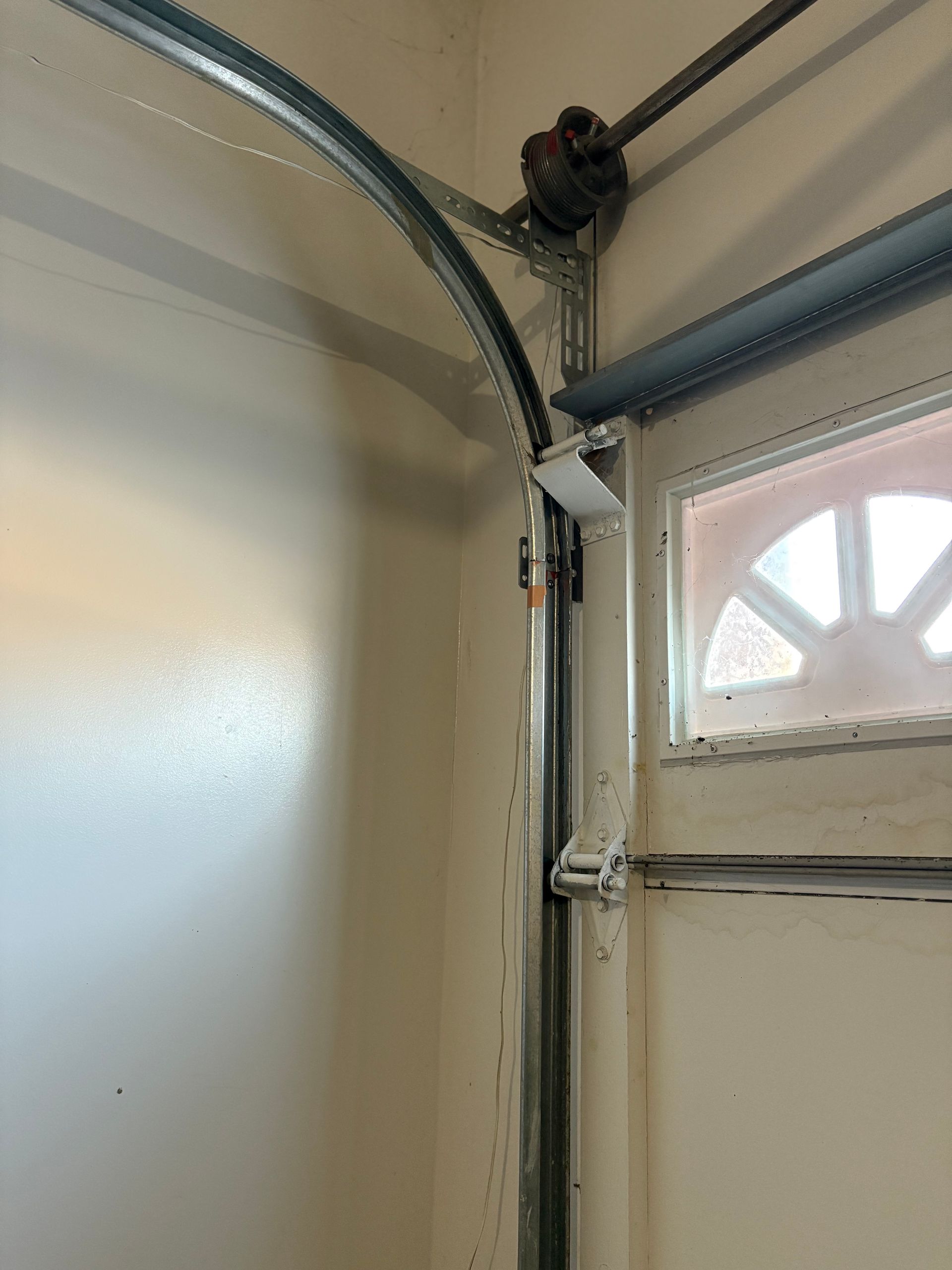 A close up of a garage door with the door open.
