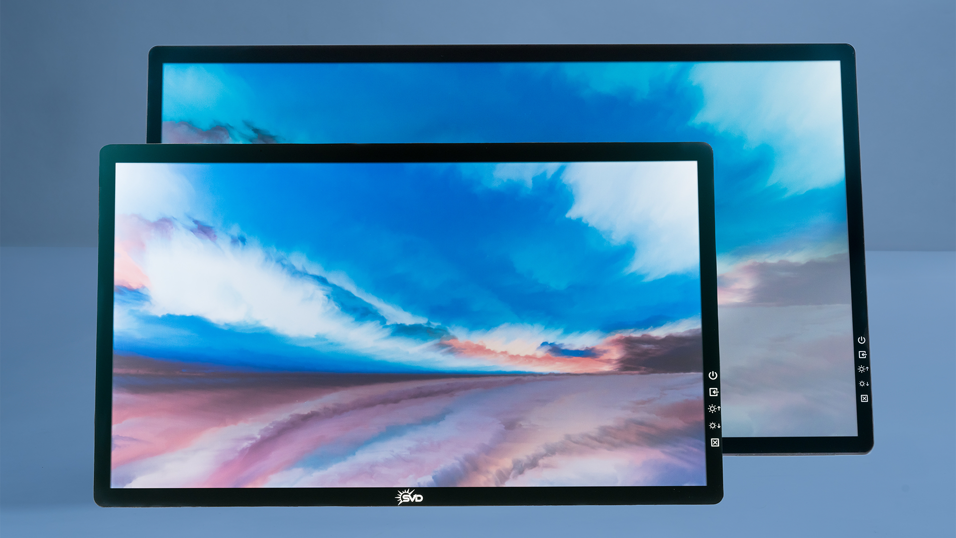 A computer monitor with a picture of a sunset on the screen