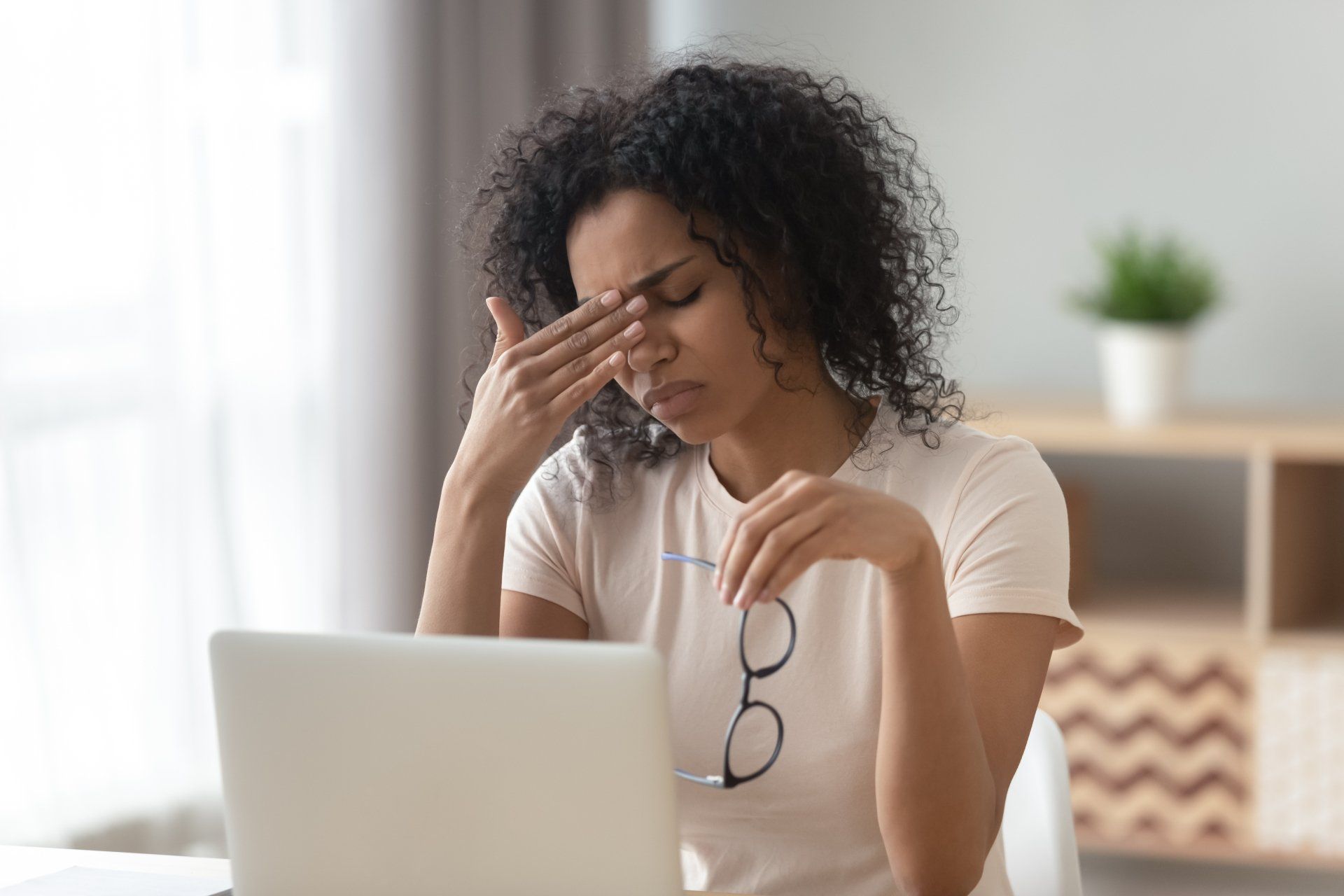 woman with digital eye strain, also known as computer vision syndrome