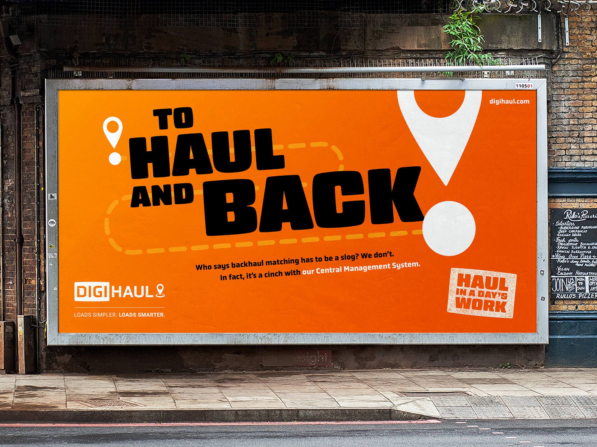 An orange billboard for DigiHaul with the text