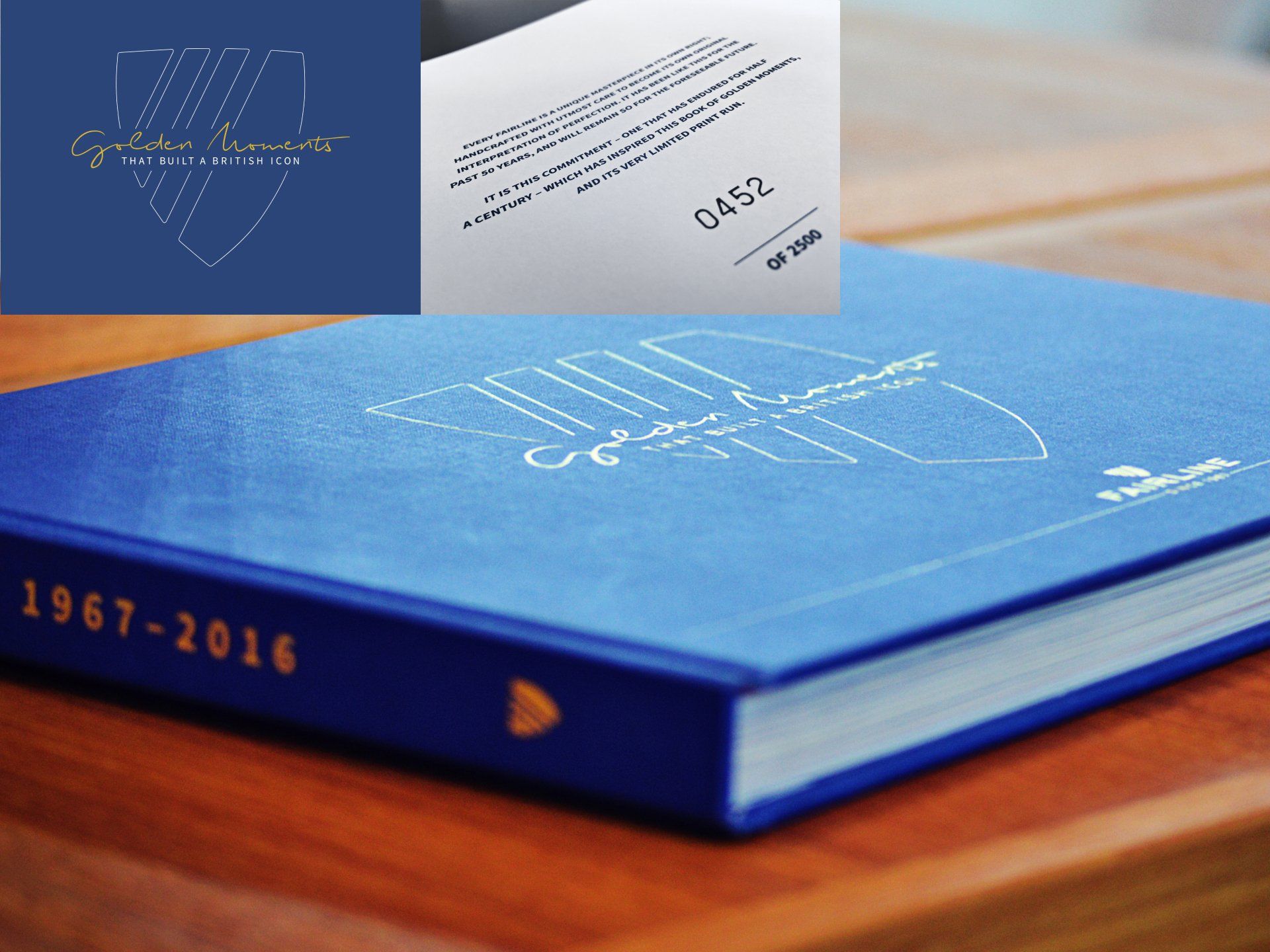 A blue book from 1967 to 2016 is sitting on a wooden table