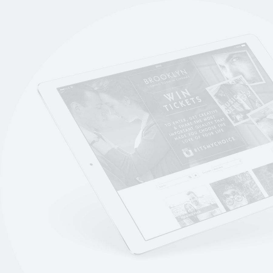 A tablet with a website on it is sitting on a table.