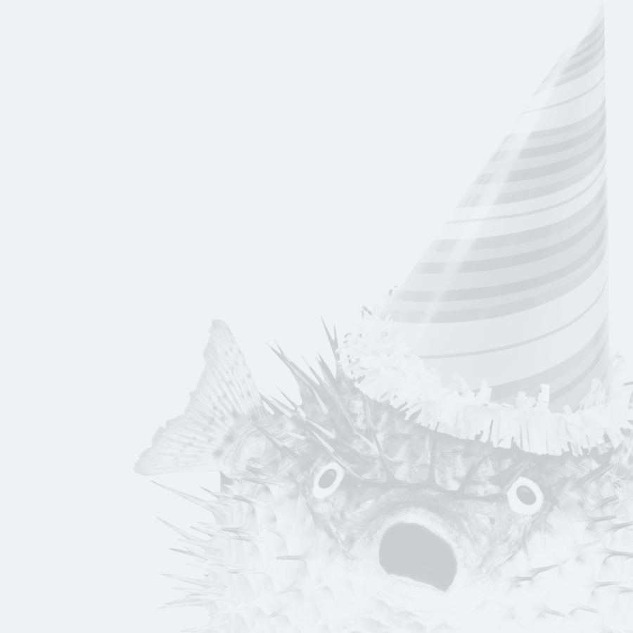 A pufferfish with a surprised expression, wearing a striped birthday party hat against a plain background.