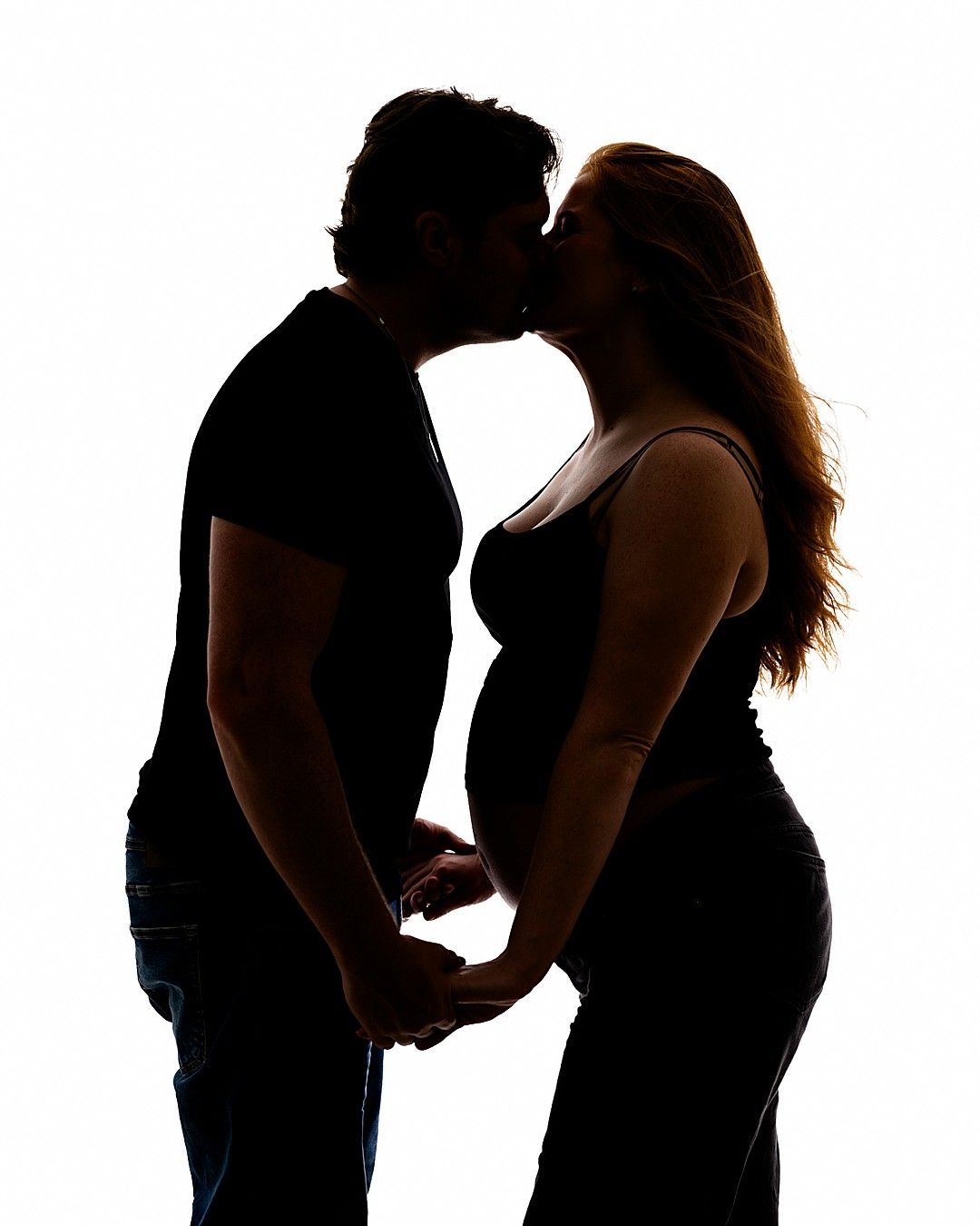 Timeless black and white silhouette of an expectant couple during a maternity photography session in Dublin.
