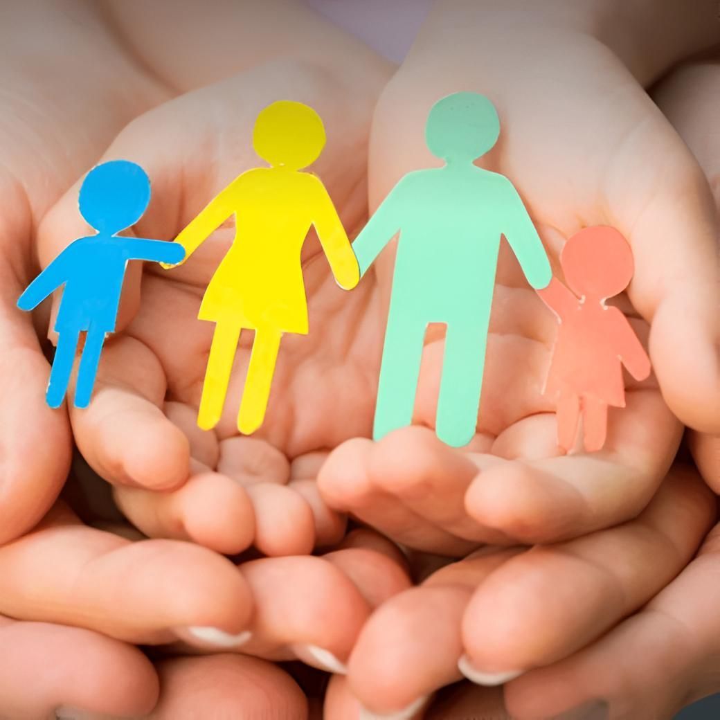 A Person Is Holding A Paper Family In Their Hands — SJP Law In Maroochydore, QLD