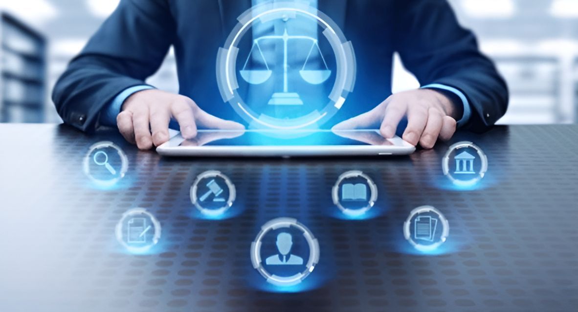 A Man Is Using A Tablet Computer With A Scale Of Justice — SJP Law In Maroochydore, QLD