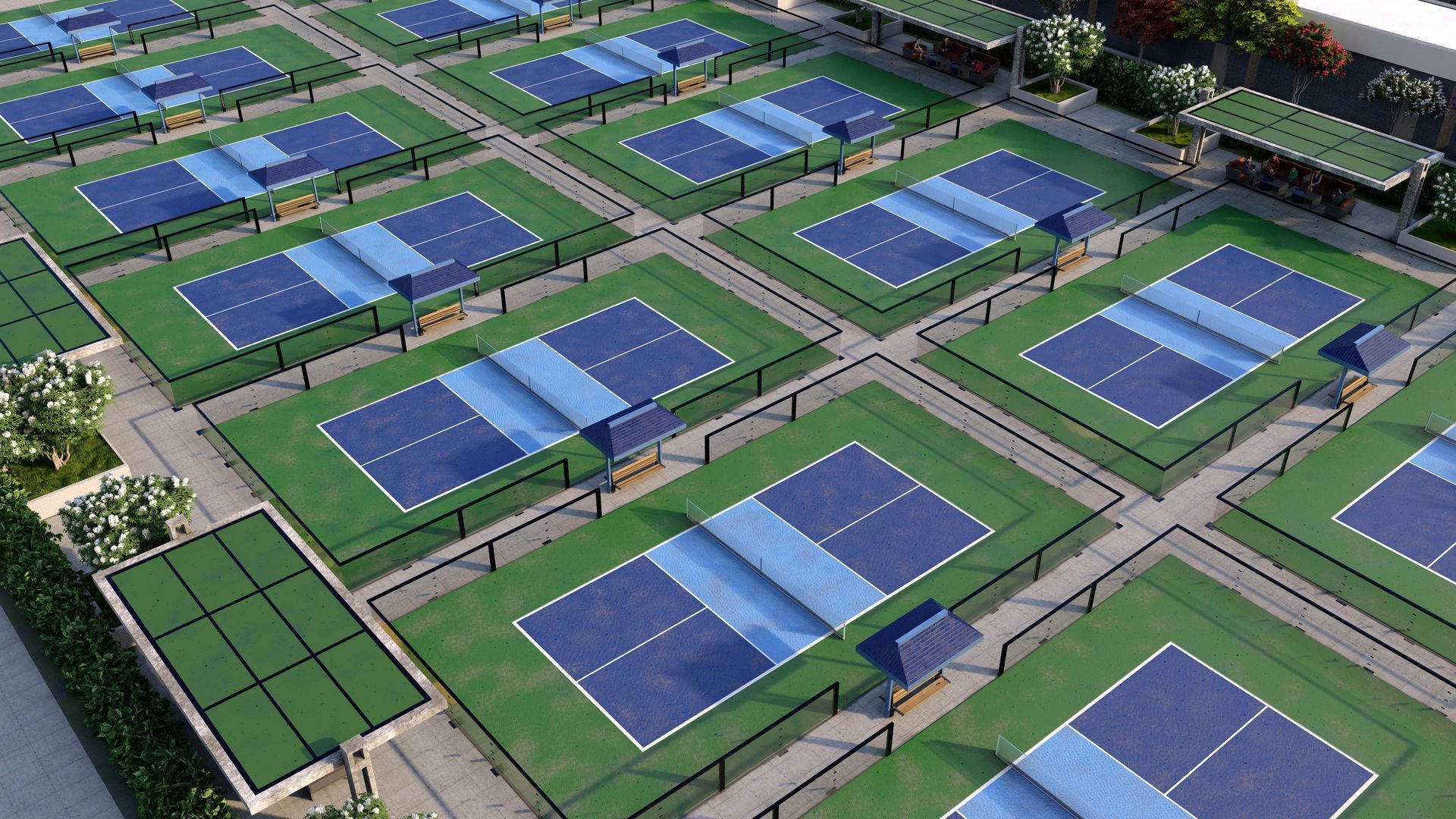 A green and blue tennis court with a black net