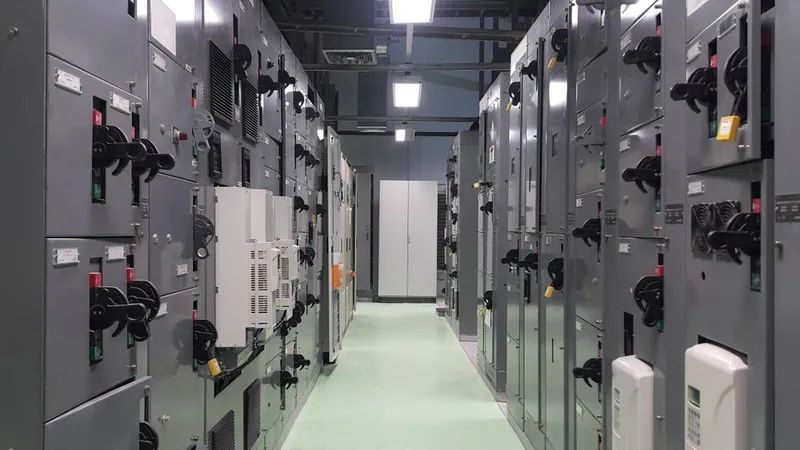 A Narrow Room With Gray Electrical Panels on Either Side — KACE Electrical Solutions In Highfields, QLD