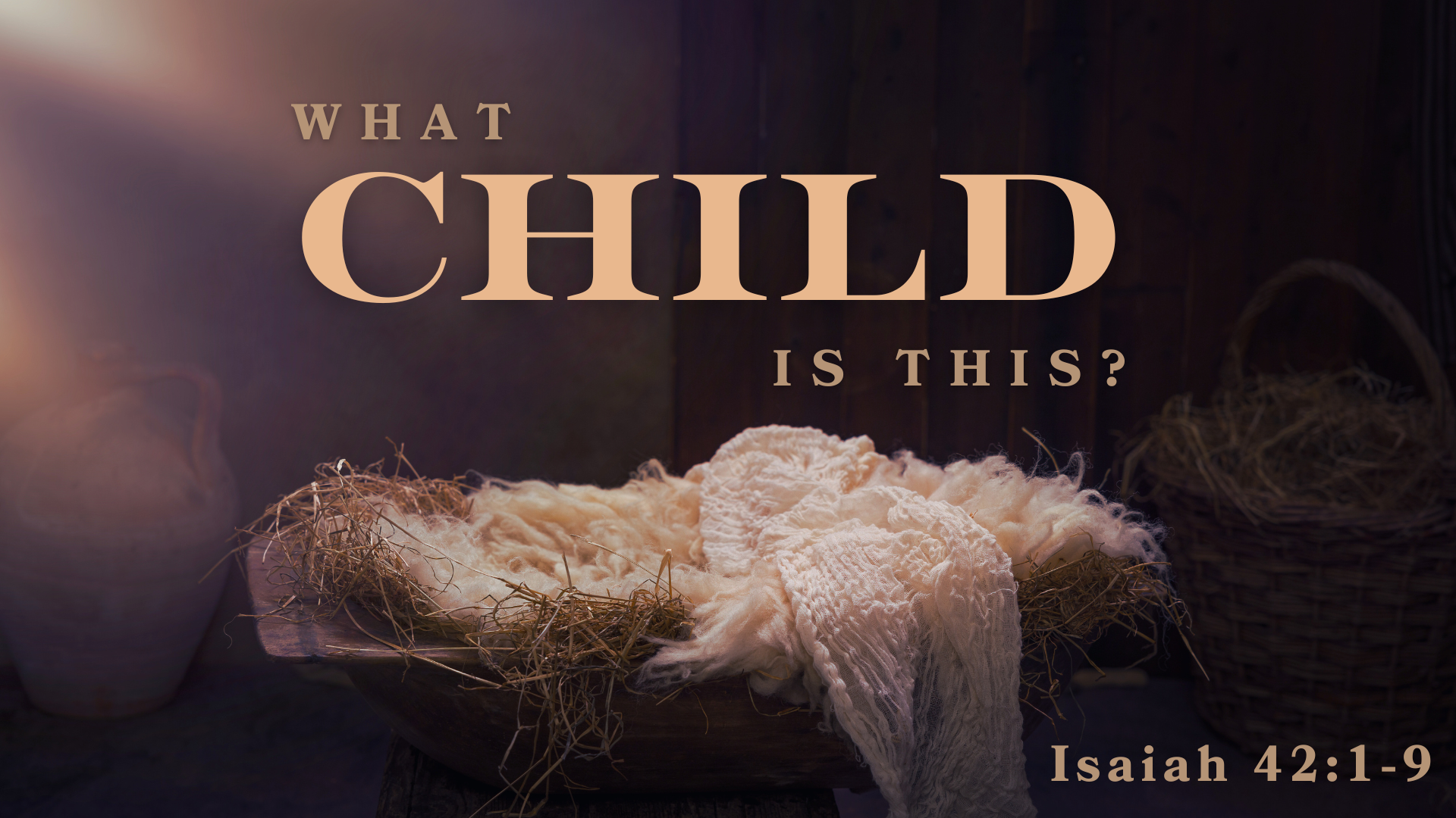 A nativity scene with a straw-filled manger and the text 