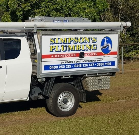 A White Water Heater is Sitting in the Middle of a Room — Simpson's Plumbing & Maintenance Service in Dakabin, QLD