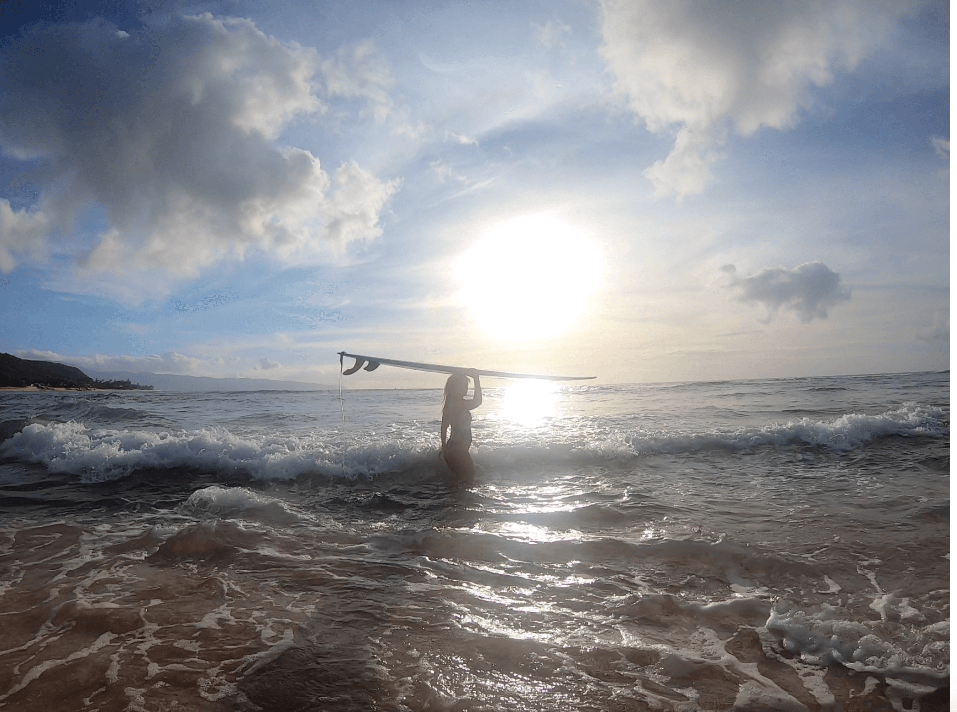 surfing at sunset