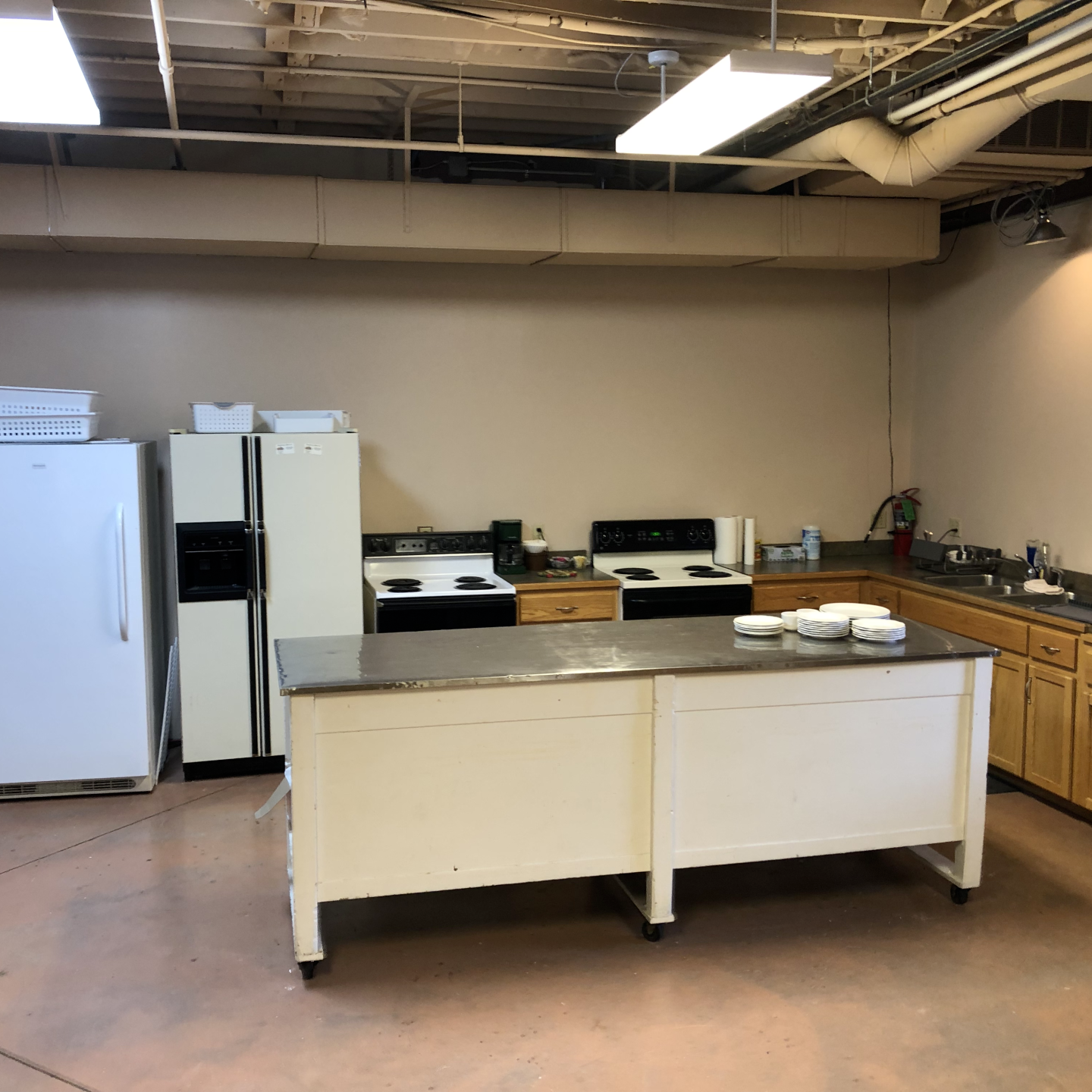 a kitchen with a refrigerator stove and sink