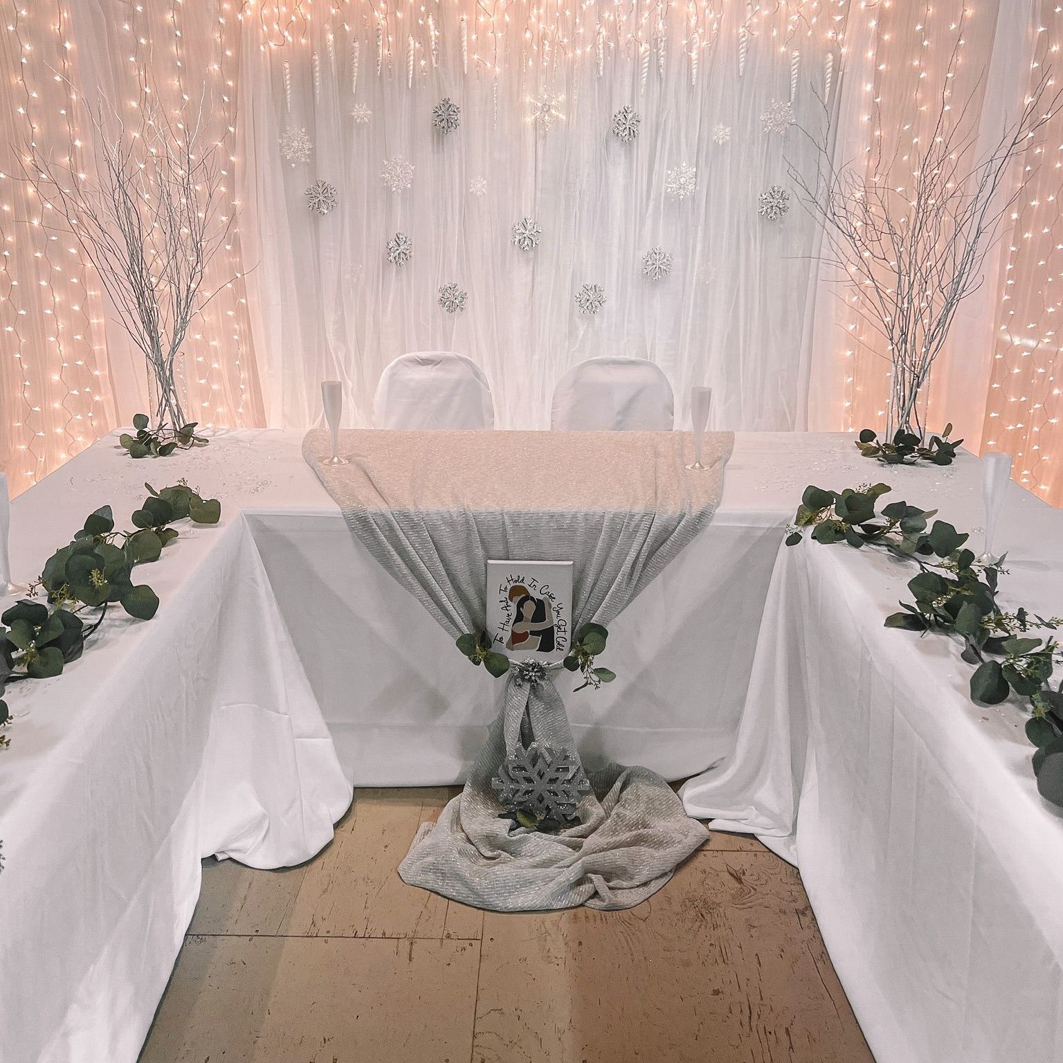 a table with a picture of a bride and groom on it, set up for a wedding reception