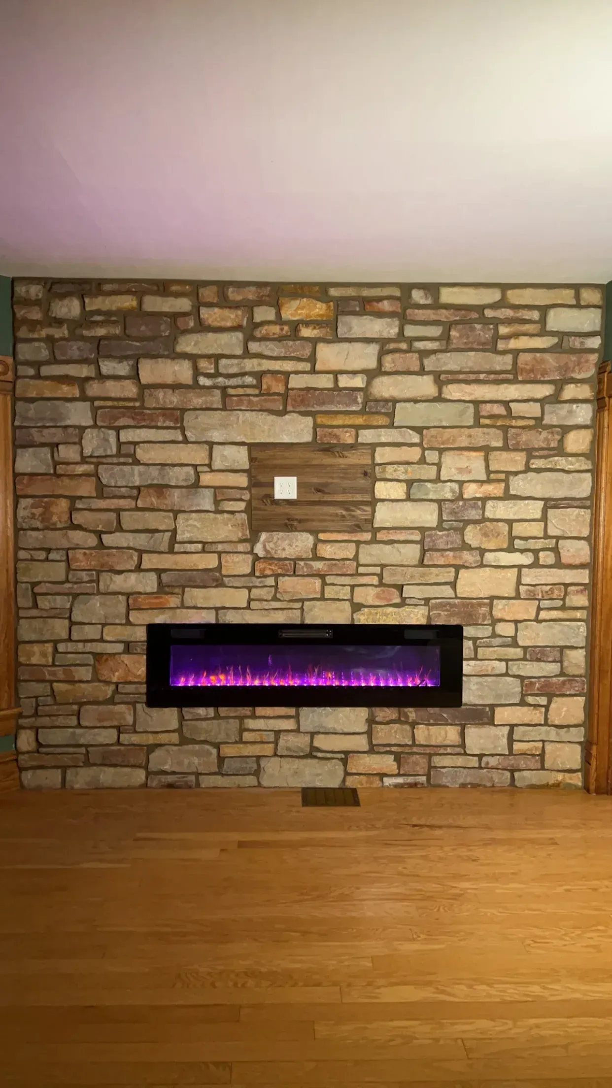 There is a fireplace in the middle of the room.