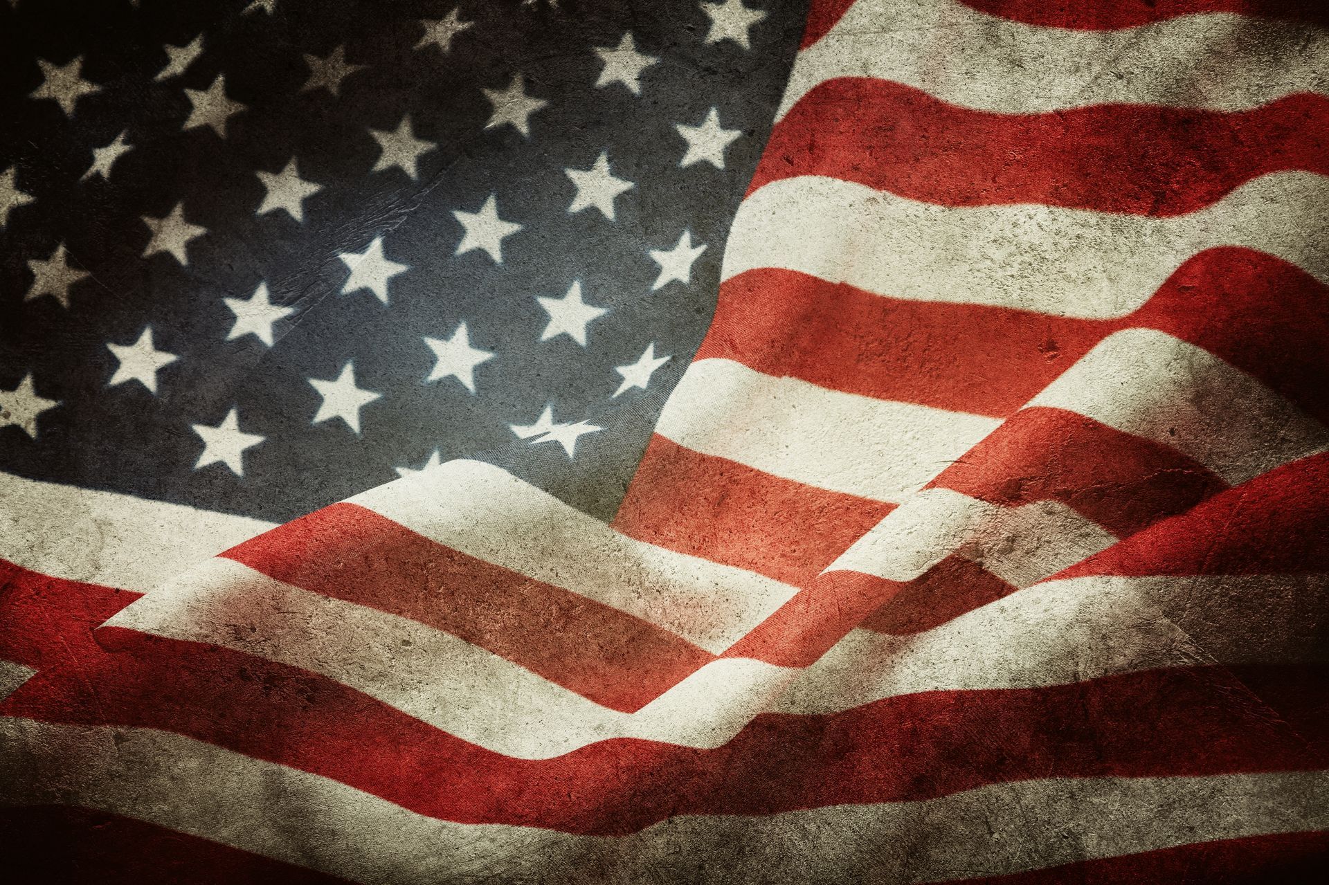 Waving American flag with red, white, and blue stars and stripes