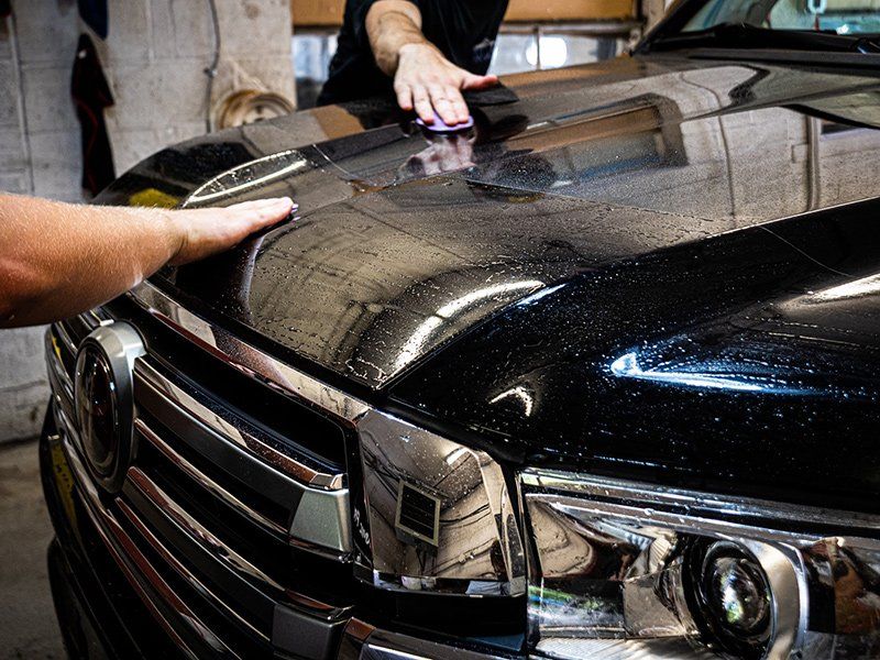 Two Men Wiping Car — Lehigh Valley, PA — Pinnacle Luxury Car Care