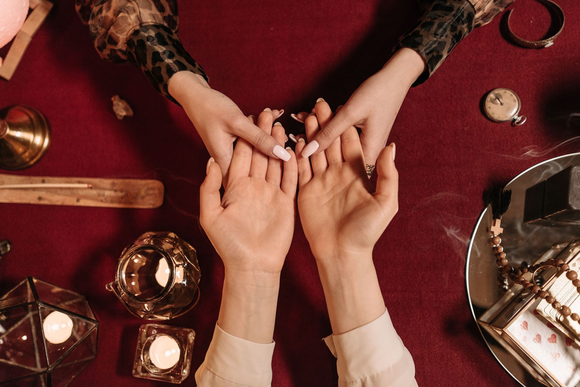 A detailed tarot spread with crystals and incense in a serene setting.