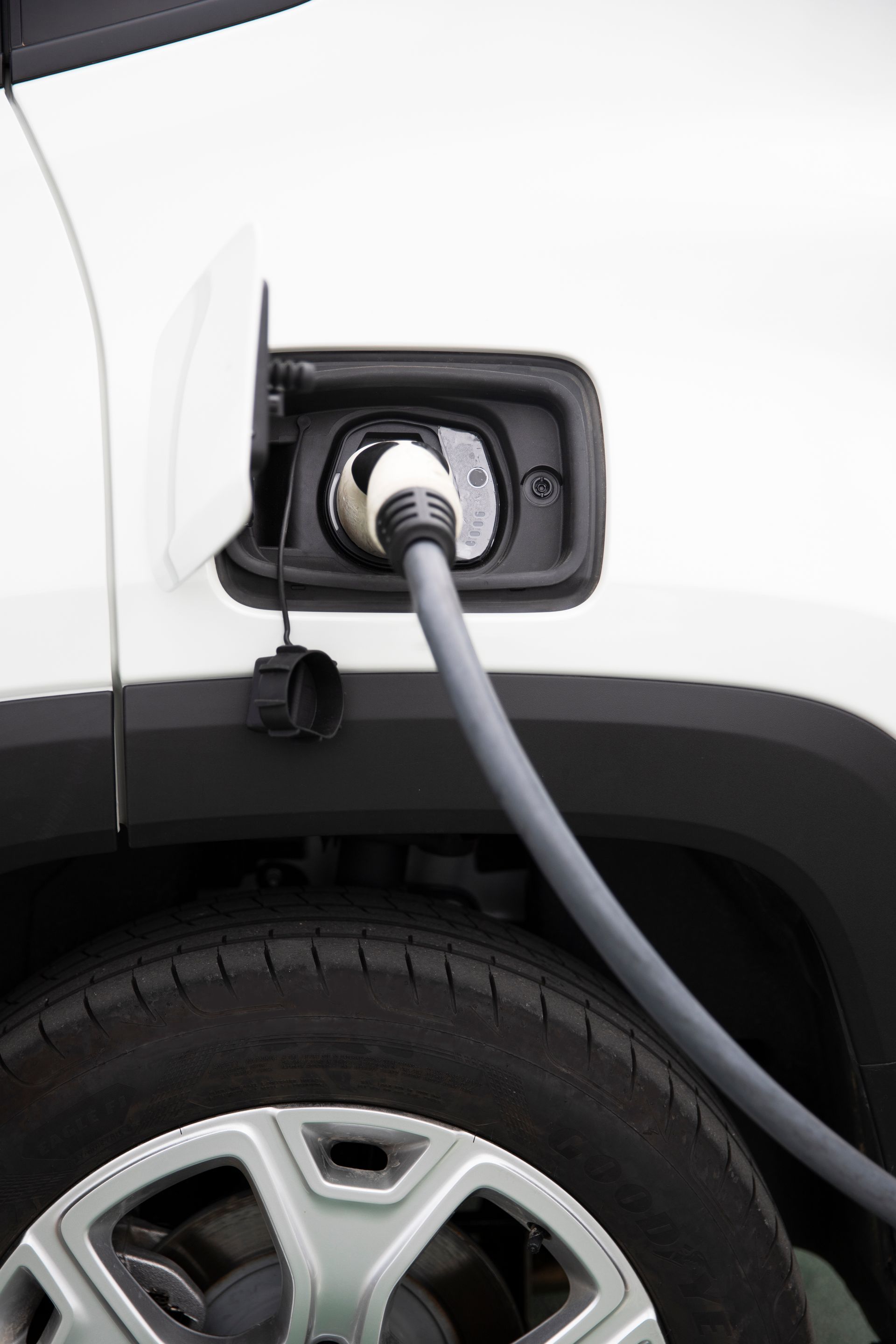 electric vehicle charger charging a white car