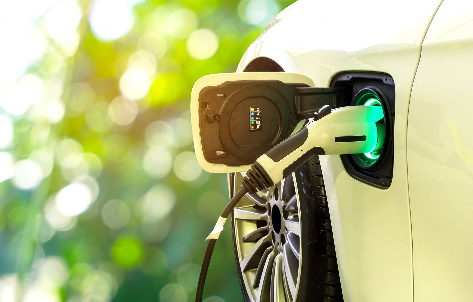 electric vehicle charger charging a yellow car