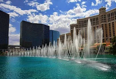A fountain in front of a large building in las vegas.