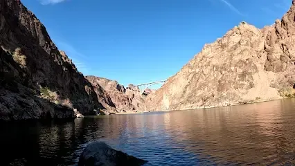 A large body of water surrounded by mountains and cliffs.