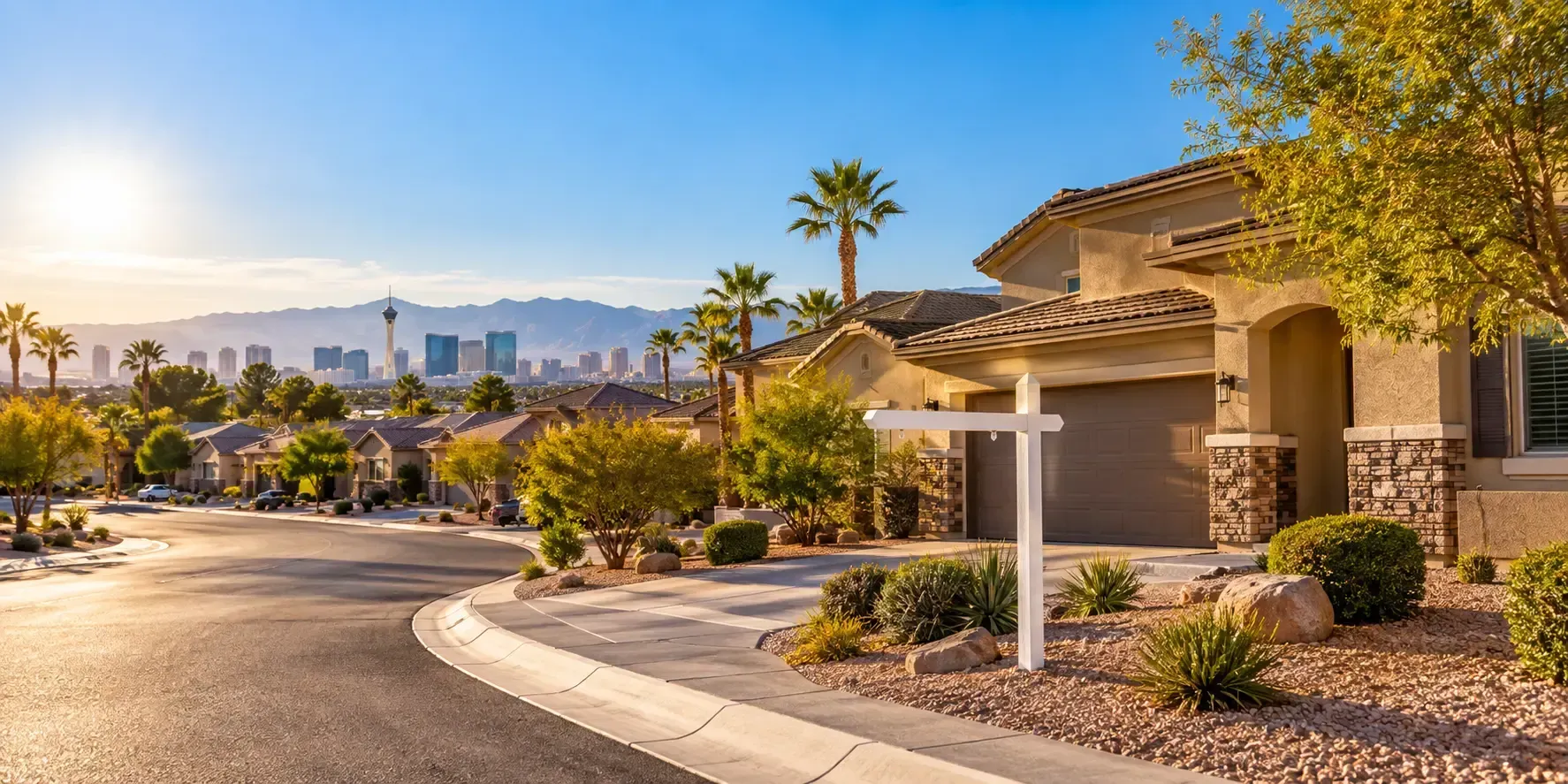 Sunlit Las Vegas residential street with stucco homes and desert landscaping