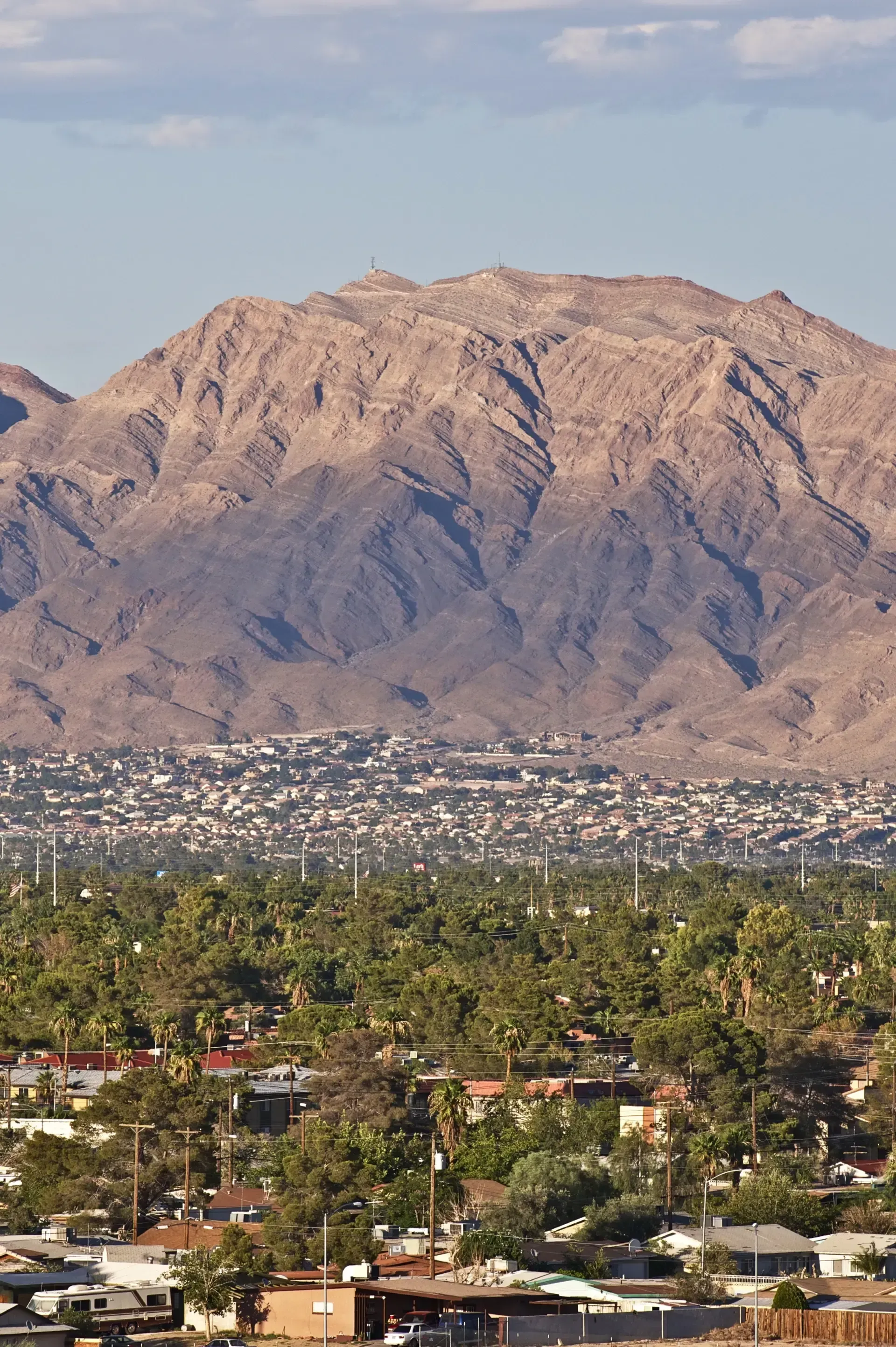 Sell My House Fast - An aerial view of a city with mountains in the background