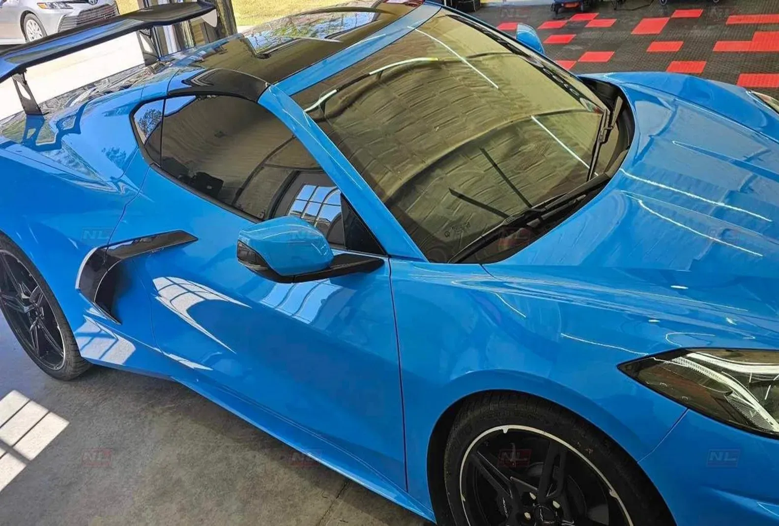 Car showcasing the quality between professional vs DIY window tint, with the pro side done by Northern Lights Home & Auto Coatings