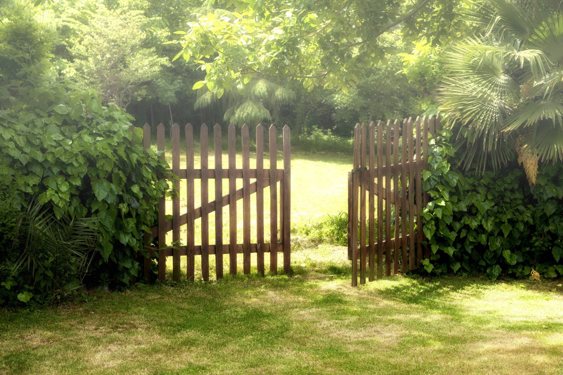 Wooden Door Fence in Garden — Lancaster, KY — Prather Landscaping