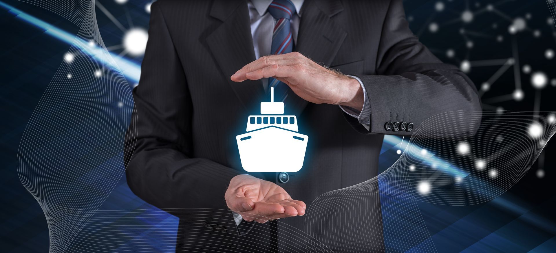 Businessman holding a glowing digital ship icon over a blue technology background