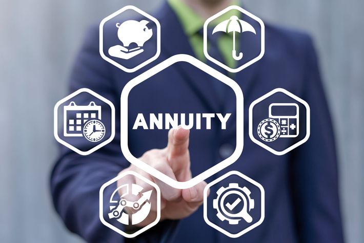Businessman presenting “ANNUITY” with financial icons on a blue background