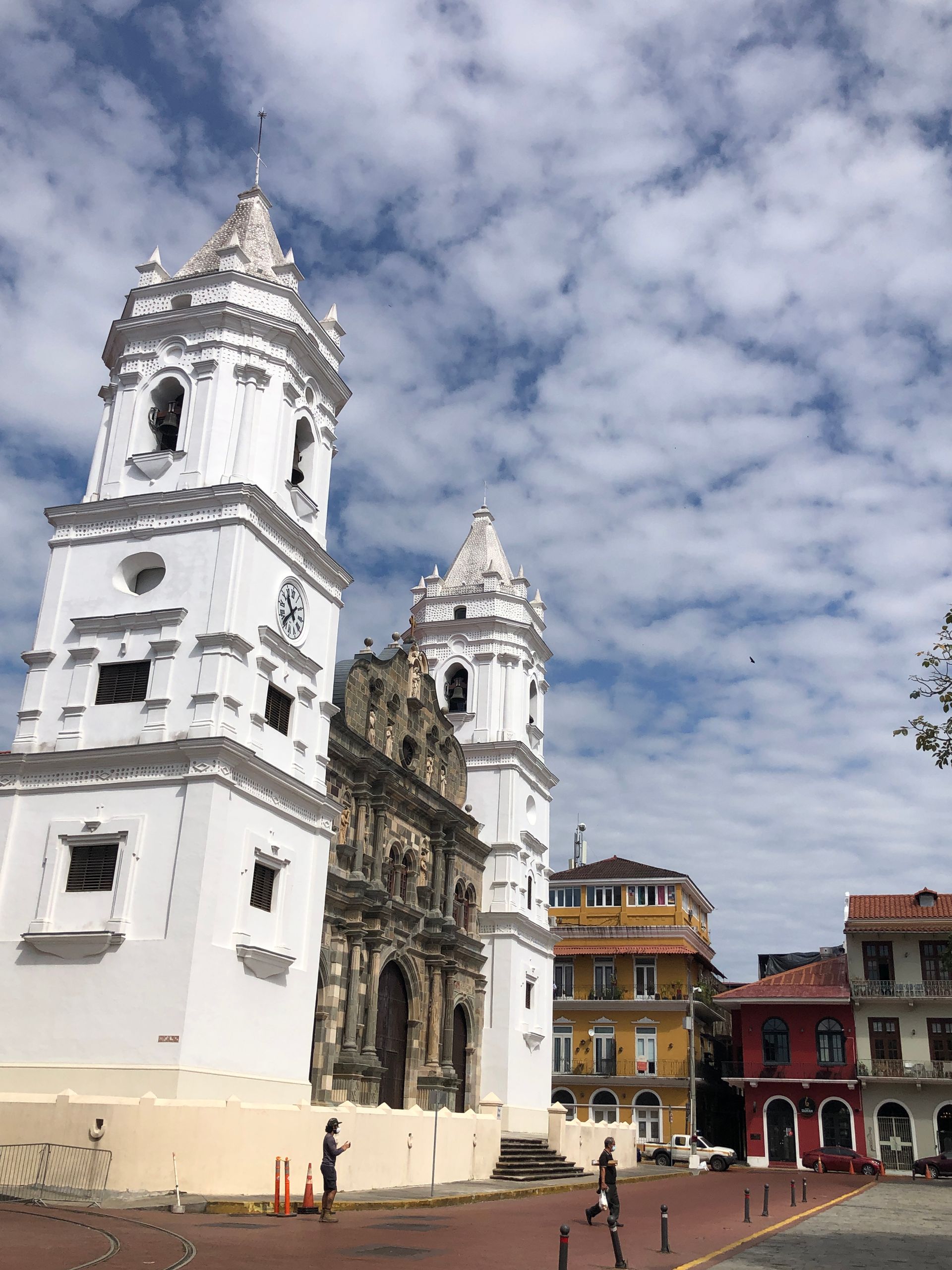 White church with two bell towers, ornate facade, sunny day in Panama City.