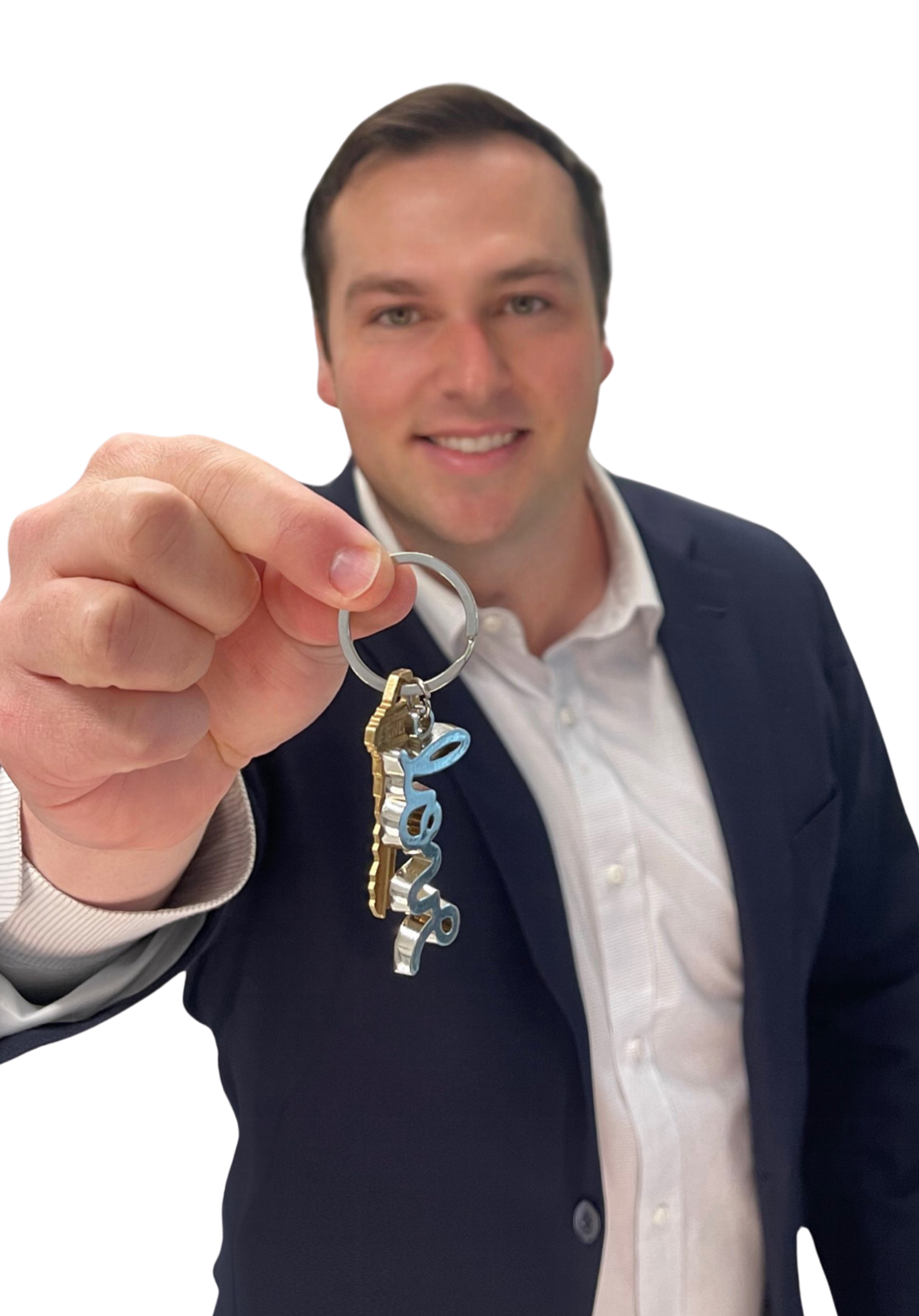 Man holding out keys, smiling, wearing a navy blazer and white shirt.