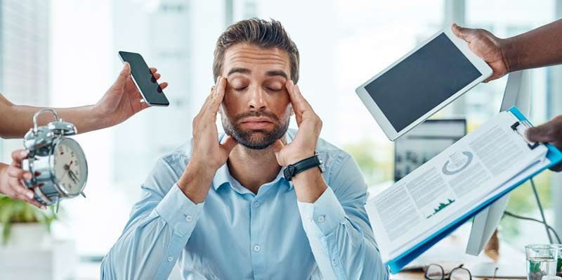A man experiencing excessive streass at work needing Acupuncture for Stress Relief