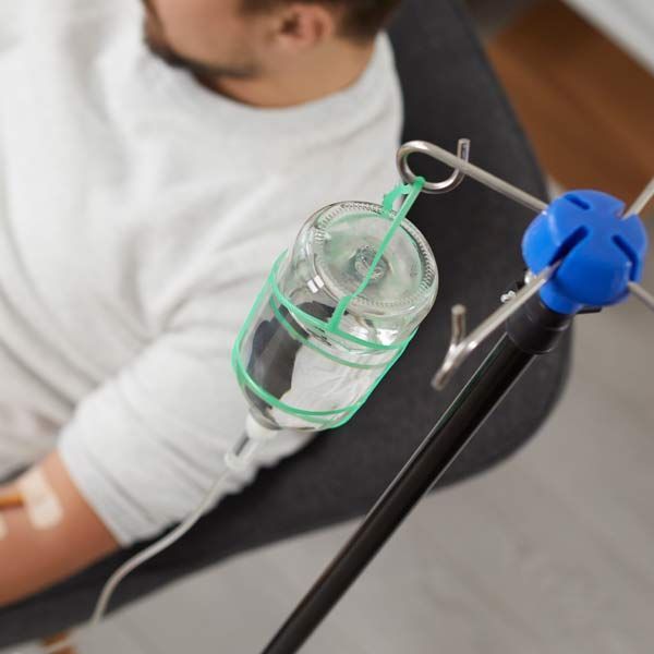 Man getting Herbal and Nutrient Infusions treatment at Holistic Acupuncture NYC