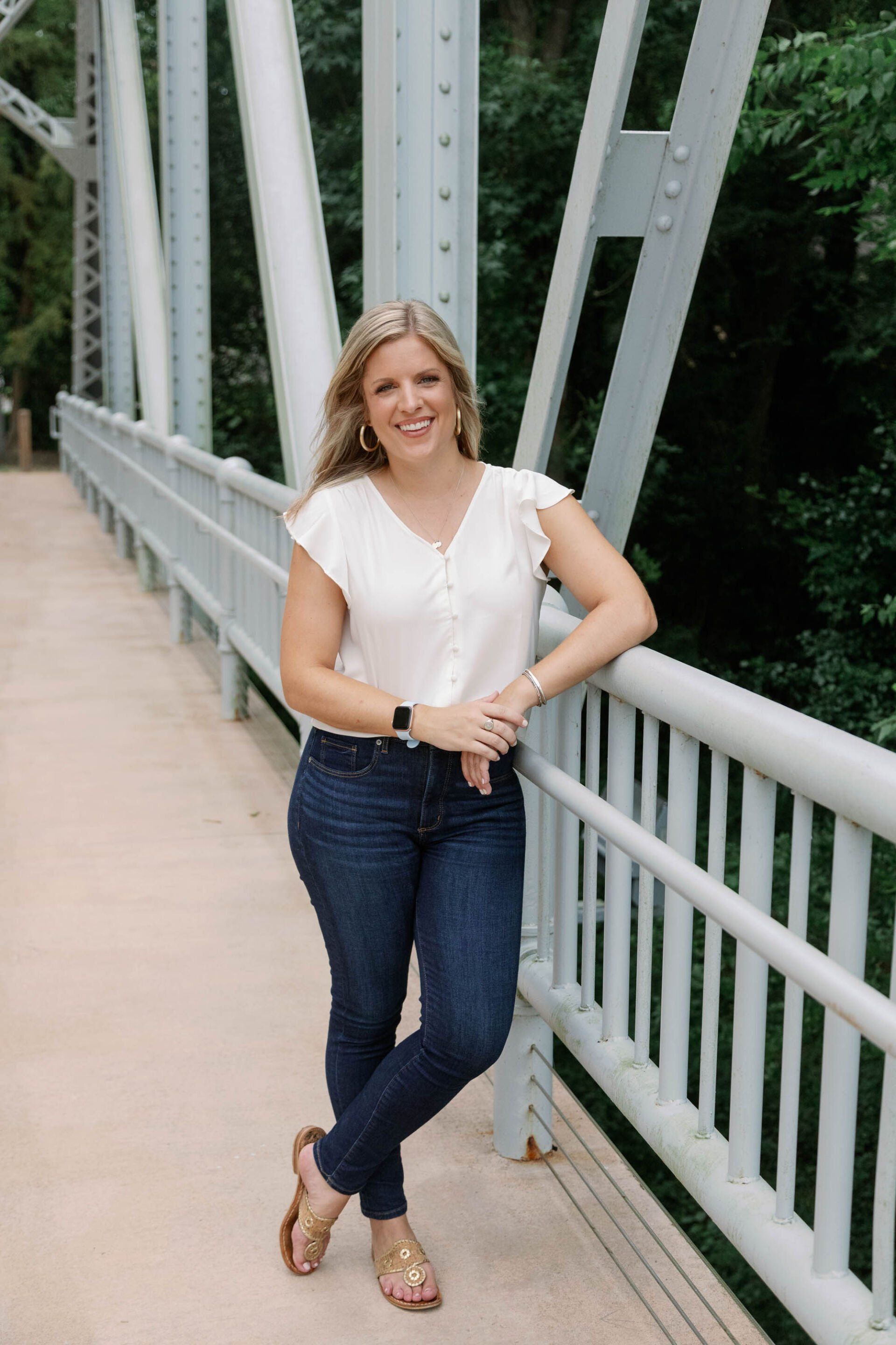 Picture of Leigh standing on a bridge