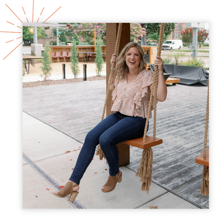 Leigh Saner sitting on a swing