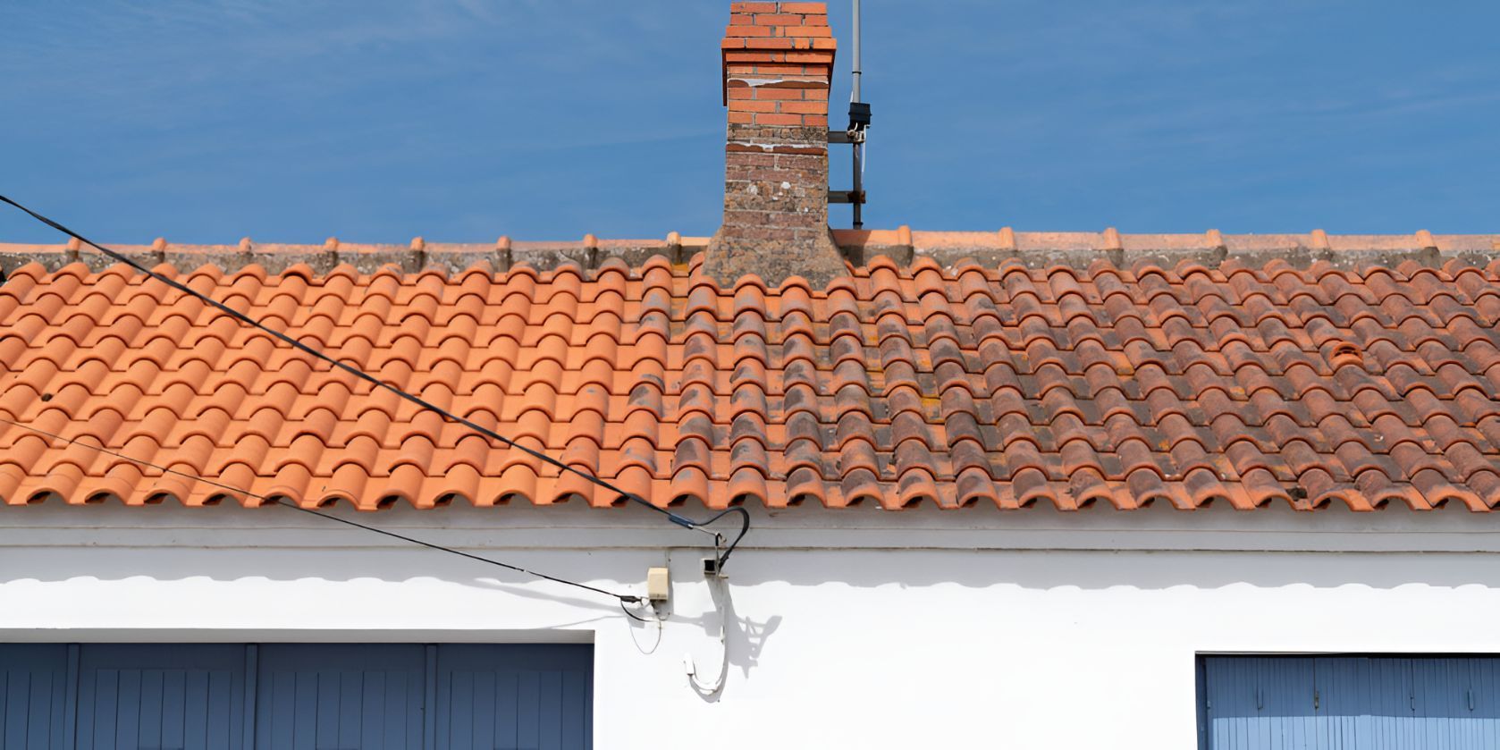 A Roof With Red Tiles and a Chimney on Top of It — Goonellabah Roof Tilers In Alstonville, NSW