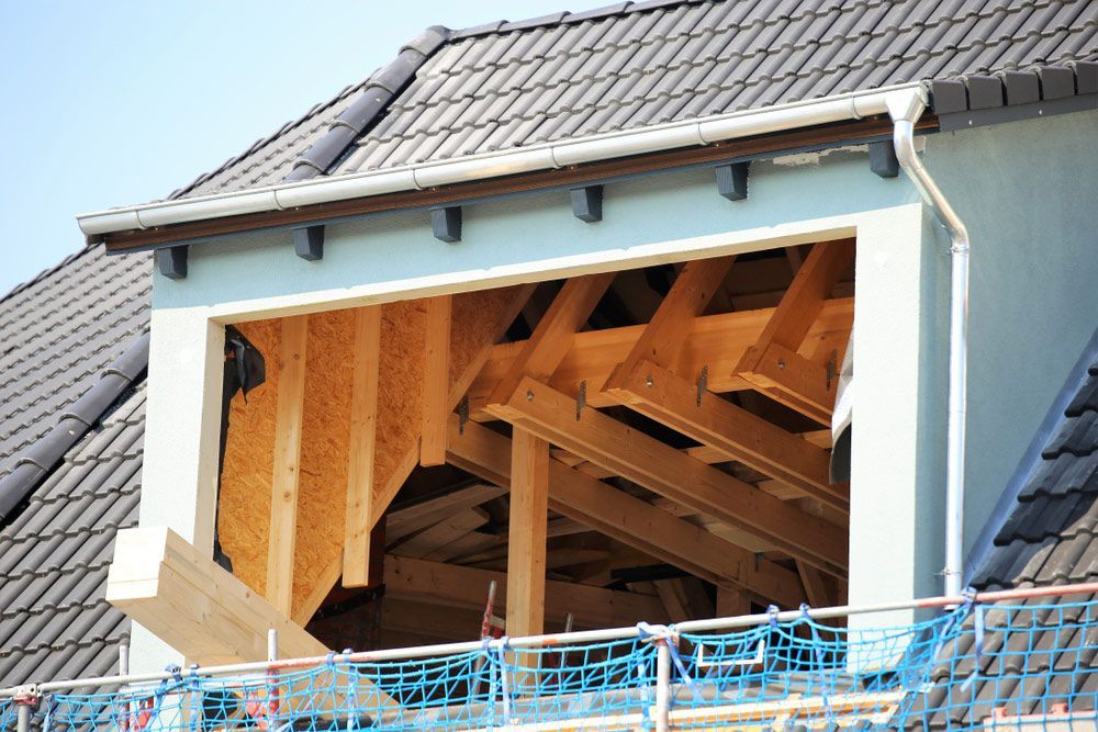 House with Grey Tiled Roofing — Goonellabah Roof Tilers In Byron Bay, NSW